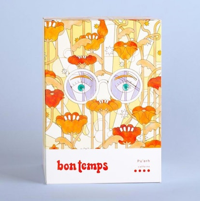 Bon Temps' Pu'erh Energy Blend packaged in a floral box that has glasses and eyes drawn on it 