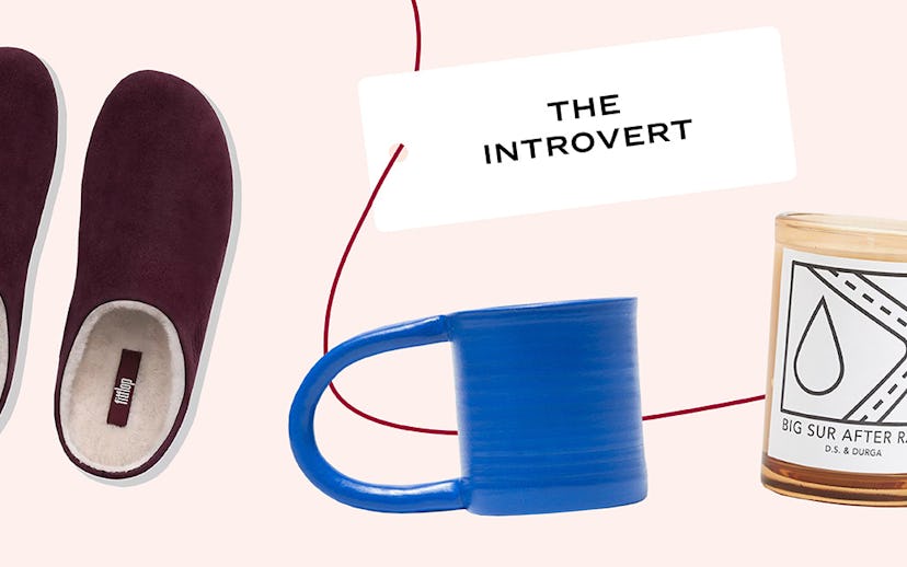 A candle, cup and slippers with card "The introvert"