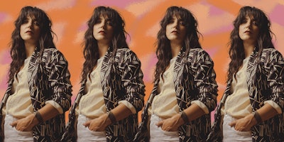 Sharon Van Etten in a patterned shirt and a hand in her pocket looking straight at the camera