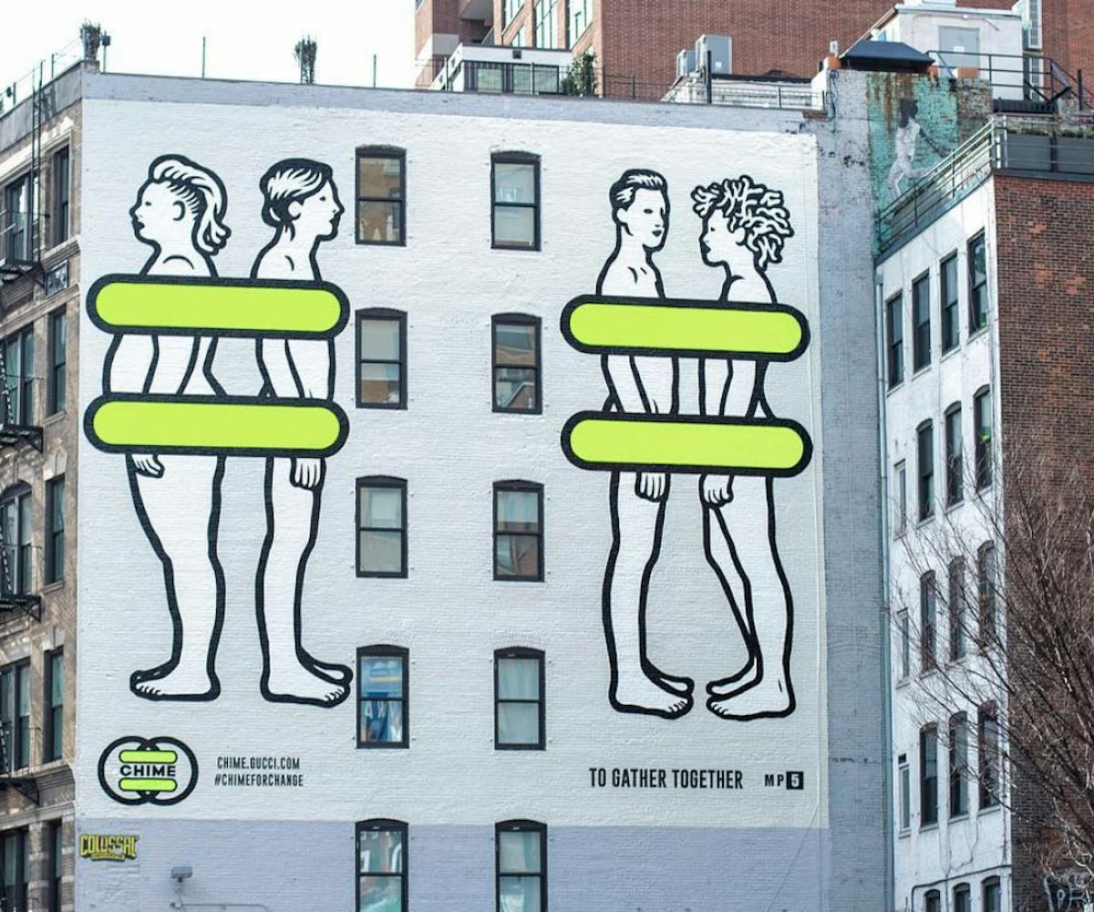 Mural of two naked people standing back-to-back and two facing each other with yellow lines covering...