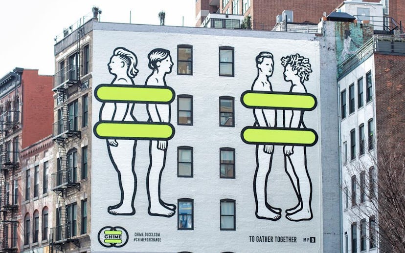 Mural of two naked people standing back-to-back and two facing each other with yellow lines covering...