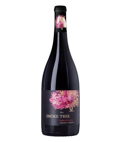A bottle of Smoke Tree's 2016 Pinot Noir in black with pink flowers on it 