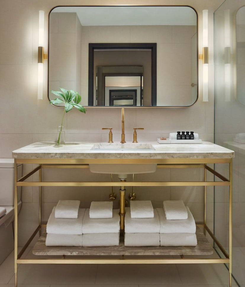 A mirror and marble sink at the spa included in the 11 Howard Heat up with Howard package 