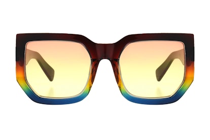 A colorful pair of sunglasses, with square, wide frames, from Kat Graham's collection, called "Servi...