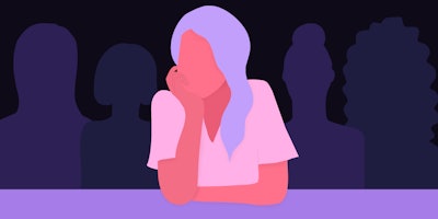 Illustration of a girl sitting alone between many people representing her anxiety.