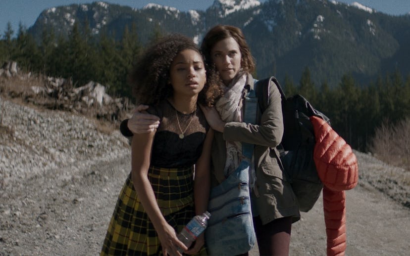 Allison WIlliams and Logan Browning in a scene of the movie 'Perfection' walking down a road