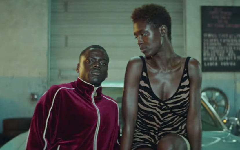 Daniel Kaluuya wearing a red jacket while Jodie Turner-Smith is looking at him in the Queen and Slim...