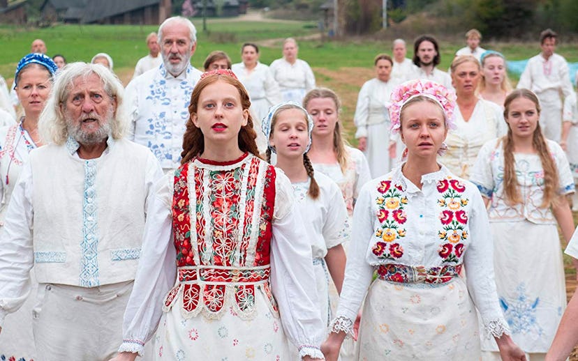 A scene from a movie "'Midsommar" with people in white outfits