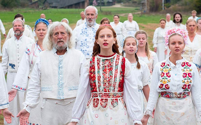 A scene from a movie "'Midsommar" with people in white outfits