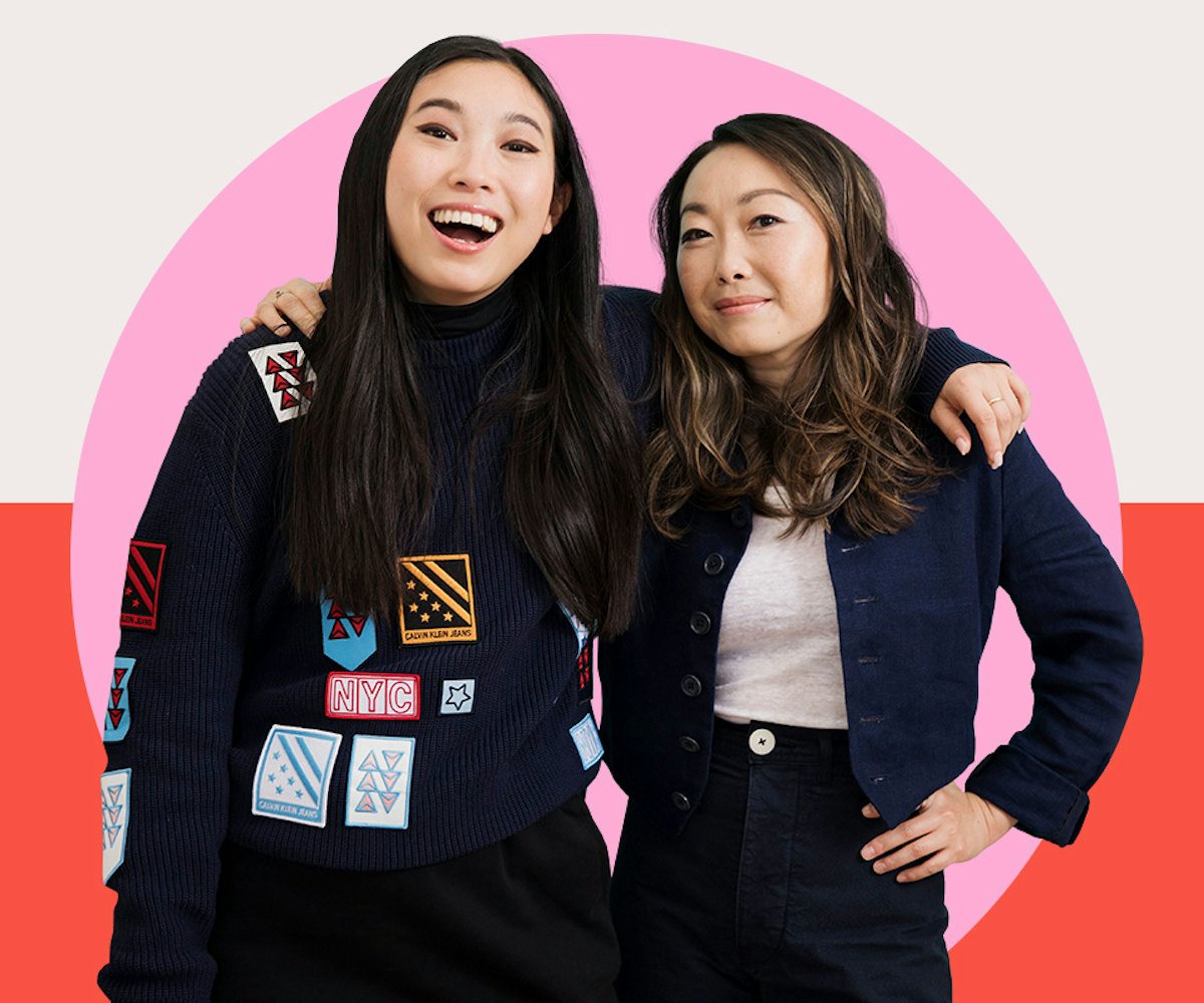 Lulu Wang and Awkwafina posing with their arms over each others shoulders