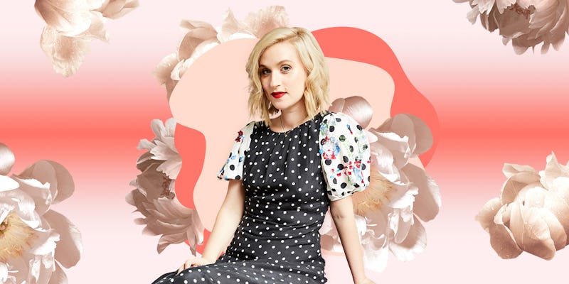 Gabrielle Korn posing in a black dress with white dots in front of a peachy-white floral background