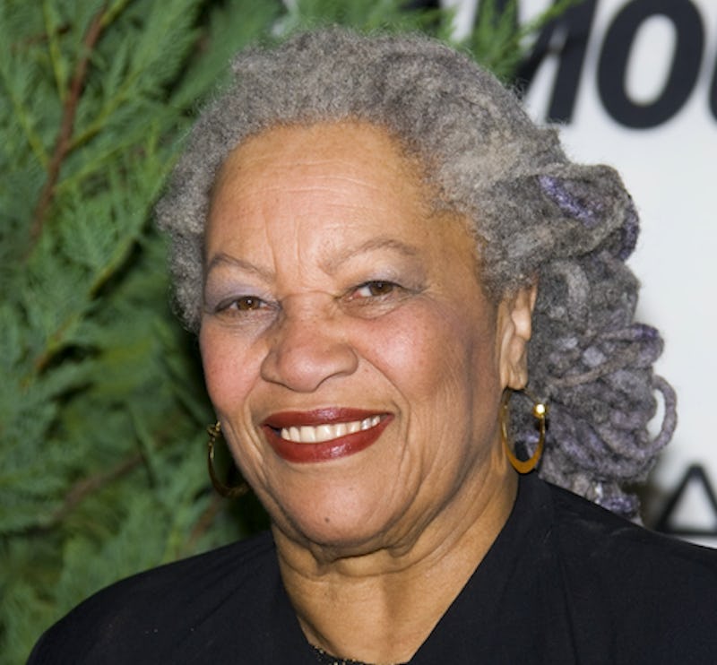 Nobel prize-winning author Toni Morrison wearing a bold red lip and smiling