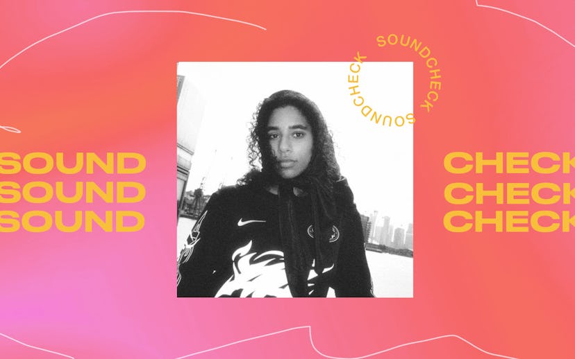 Ama Jones with curly hair wearing a hoodie in a black-and-white picture