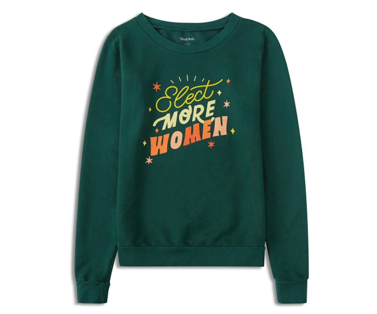 A green shirt that has the words "Elect More Women" on it with a few stars around it