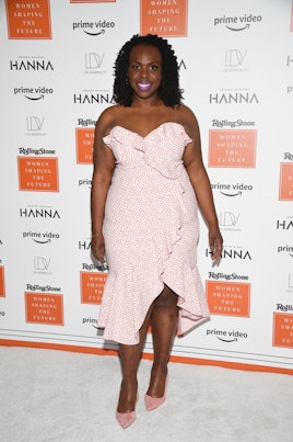 Co-founder of CurvyCon, CeCe Olisa wearing a pink dress and heels