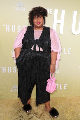 Influencer and creator of #FatAtFashionWeek, Kellie Brown wearing a black and pink outfit