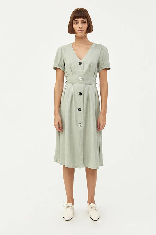 A model in NEED's pistachio Amelia button down dress