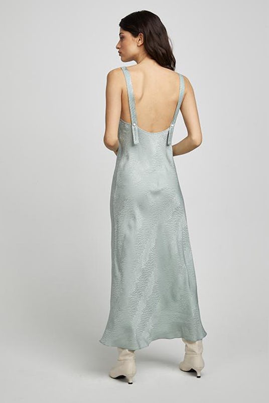 A model in a Silk Laundry deco slip dress eucalyptus jacquard