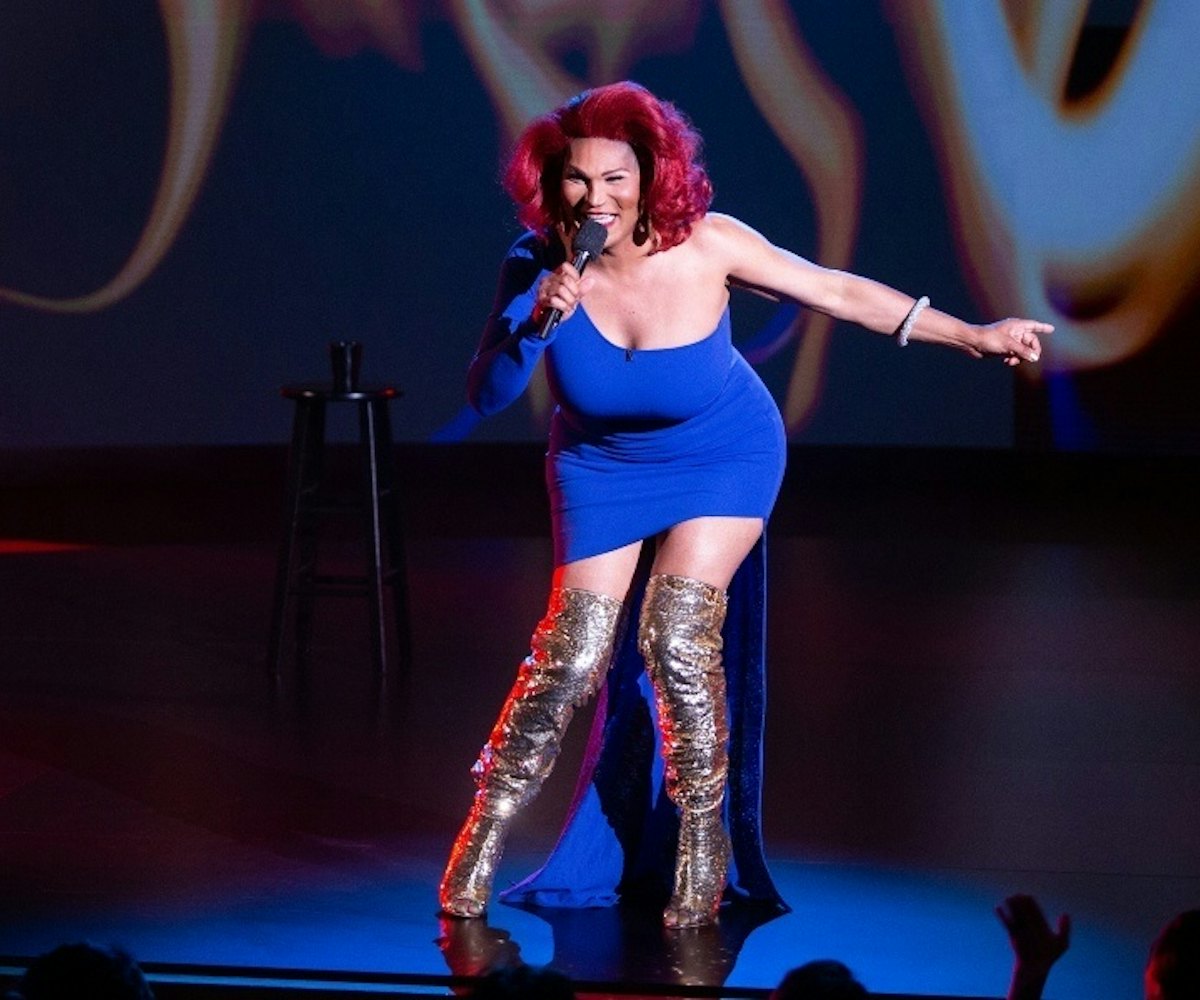 Red-haired comedian and trans woman Flame Monroe wearing a blue dress in a show 'They Ready' on Netf...