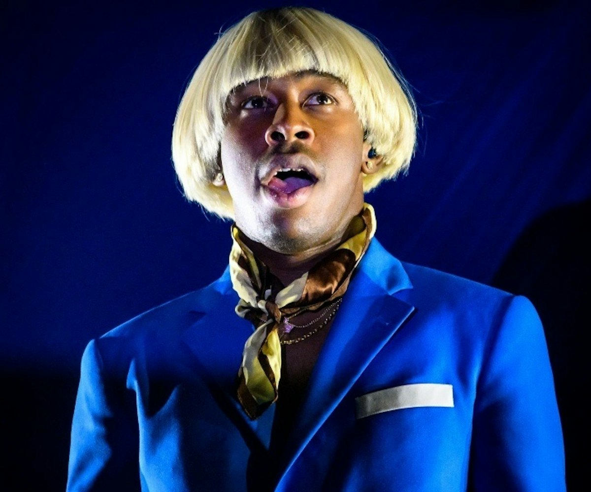 Tyler Gregory Okonma better known as Tyler, the Creator wearing a light blue suit and a blond wig