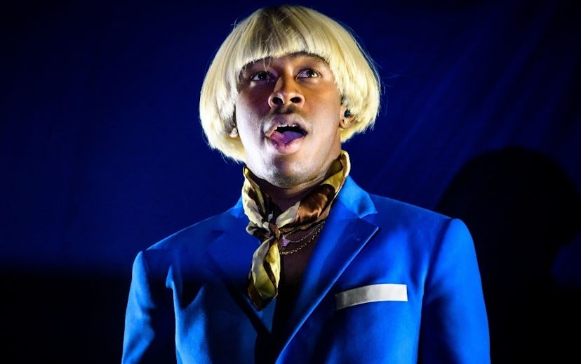 Tyler Gregory Okonma better known as Tyler, the Creator wearing a light blue suit and a blond wig