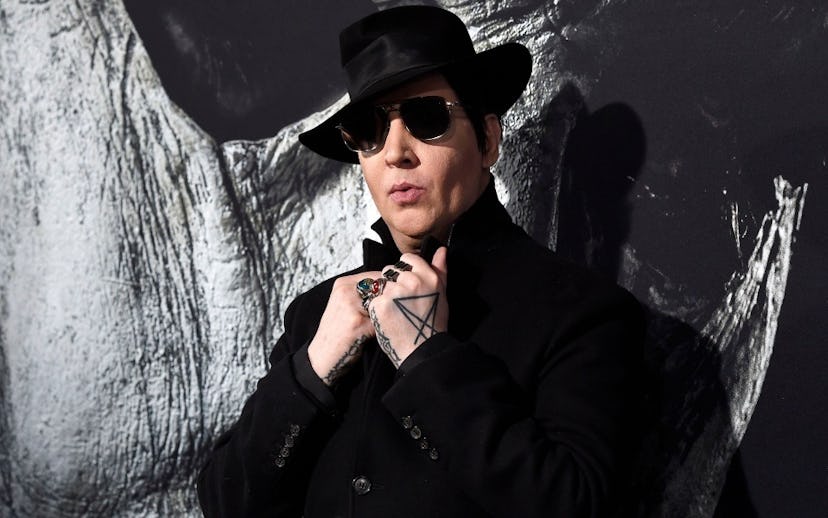 Marilyn Manson in 'American Gods' Season 3 in sunglasses, a black hat and jacket