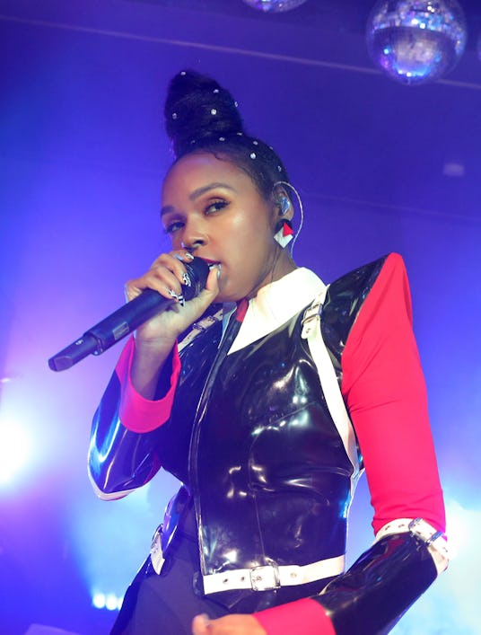 Janelle Monáe performing at a concert with her bedazzled bun 