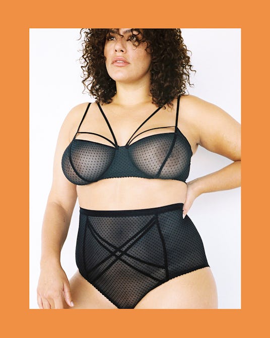 The model wearing a black see-through Gigi Underwire Bra Black Dot and High Waist Brief Black Dot by...