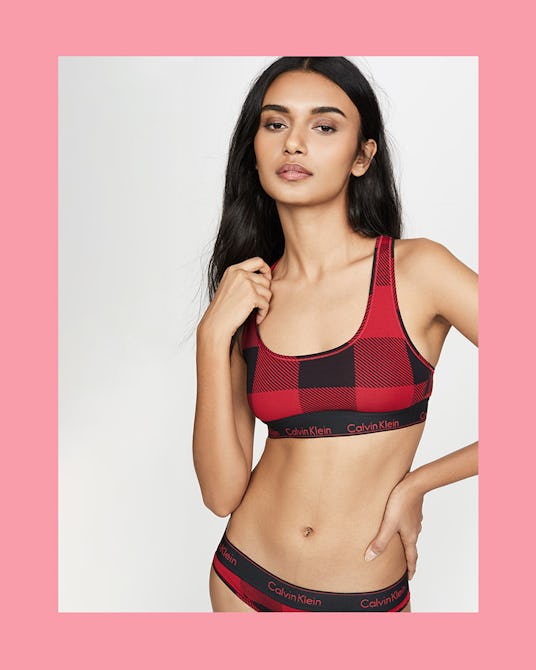 The model posing in a Modern Cotton Buffalo Plaid Bralette and Bikini Panties by Calvin Klein.