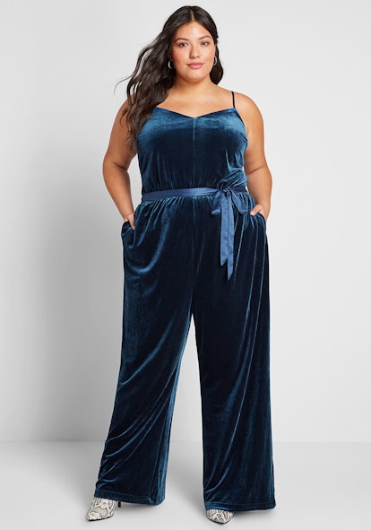 A model wearing Modcloth, She's So Fancy blue Velvet Jumpsuit