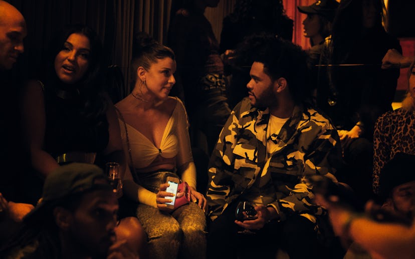 The Weeknd scene from uncut gems while hanging out with people at a party
