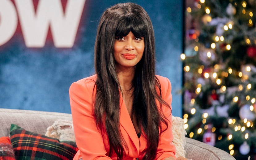Jameela Jamil smiling at a talk show