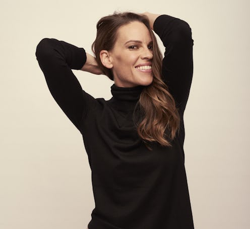 Hilary Swank posing in her new activewear line