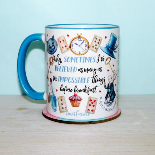 Alice in Wonderland mug in front of a blue wall