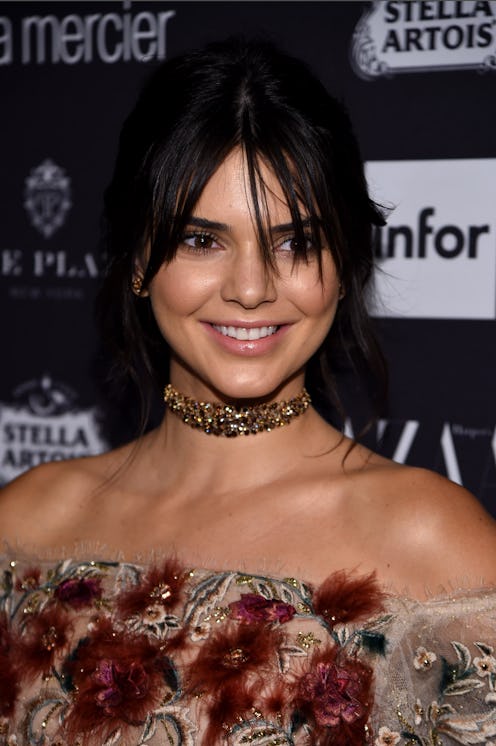 Kendall Jenner in a brown dress with red leather