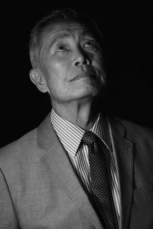 George Takei, an American actor, author, and activist, wearing a suit while posing for a photo