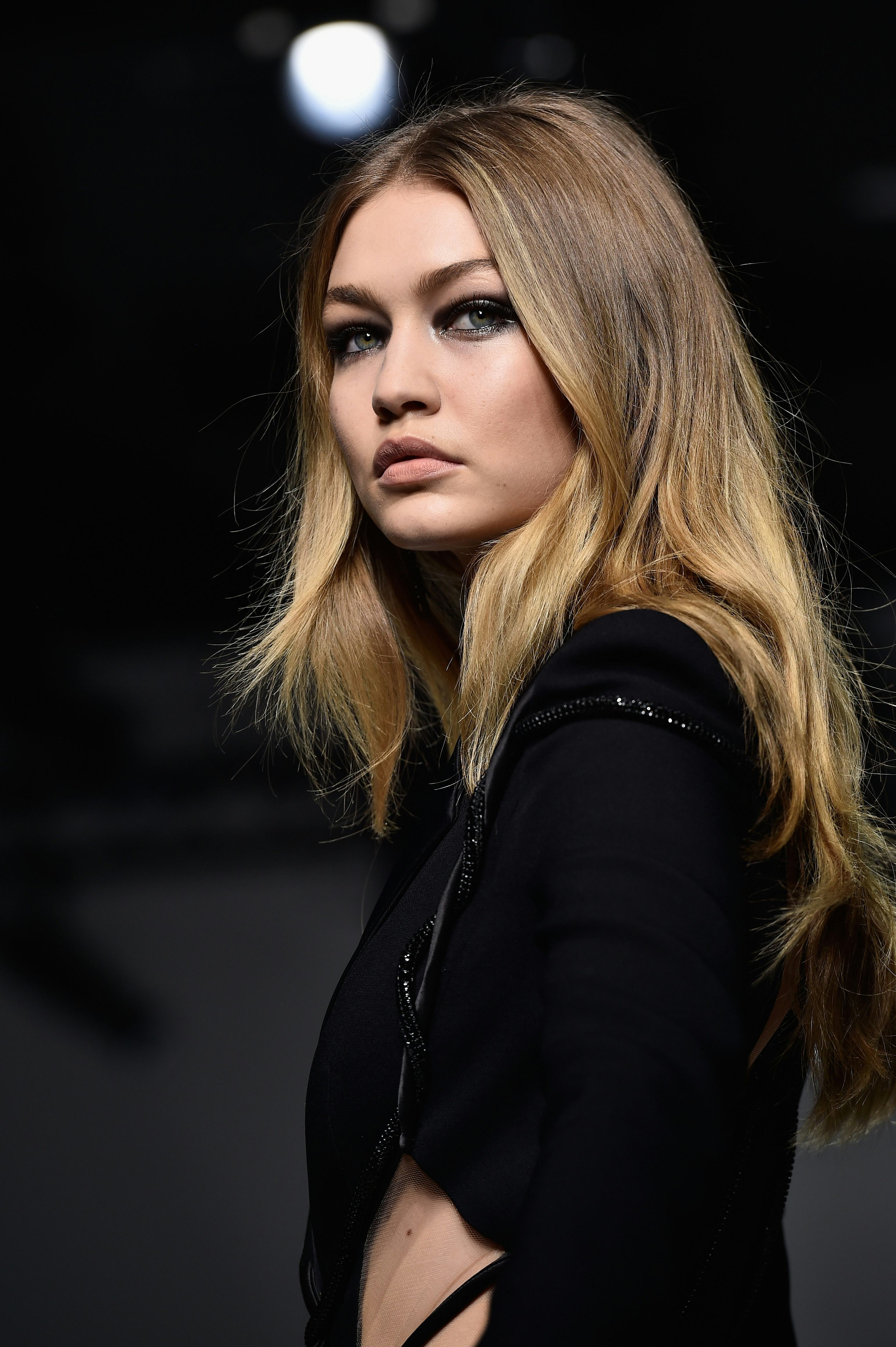 Gigi Hadid Walks Versace Runway In Shredded Pantsuit For Paris Couture