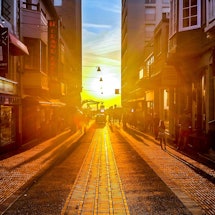 A street illuminated by the sunset during the Summer Solstice