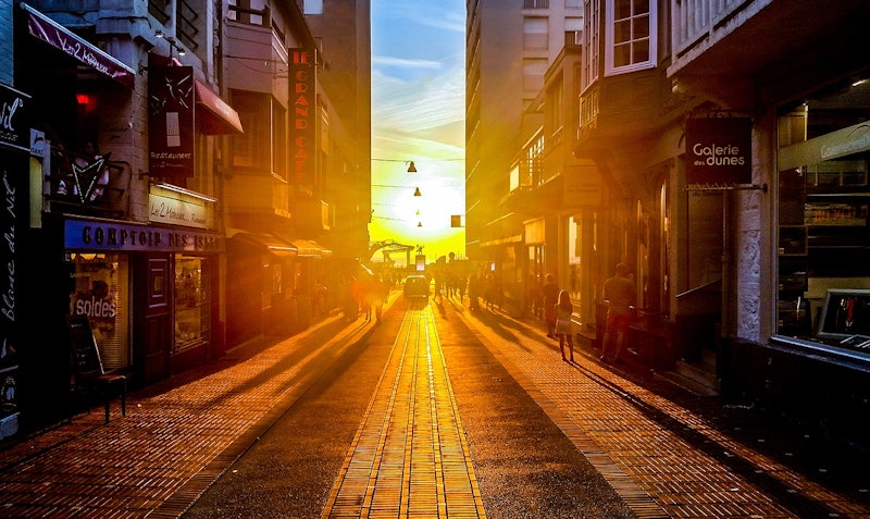 A street illuminated by the sunset during the Summer Solstice