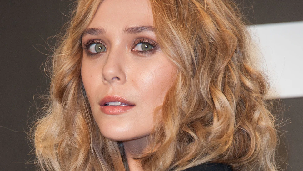 Elizabeth Olsen Nails Menswear Trend While Channeling Her Sisters