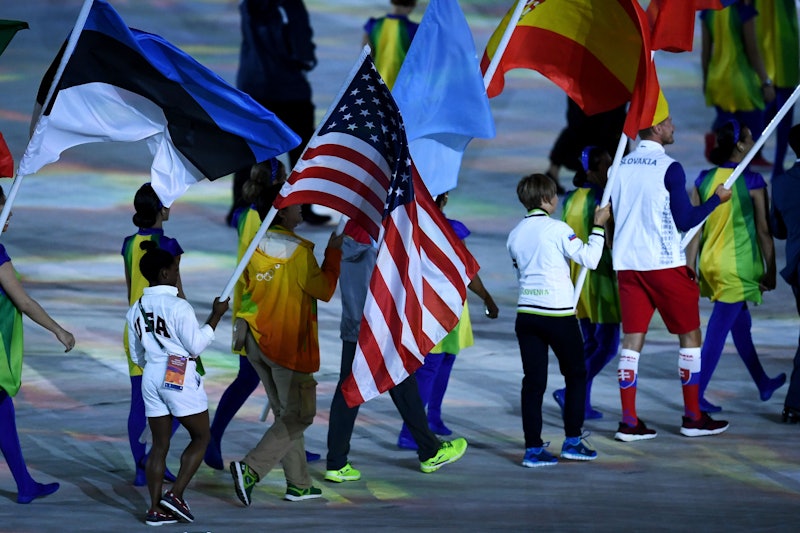 this-adorable-photo-of-simone-biles-with-the-team-usa-flag-shows-what-a-powerhouse-the-athlete-is