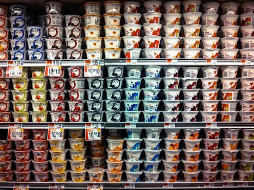 A store shelf full of low-fat yogurts.