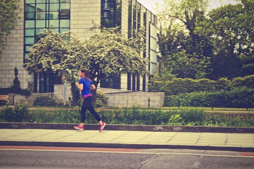 A woman running down a street