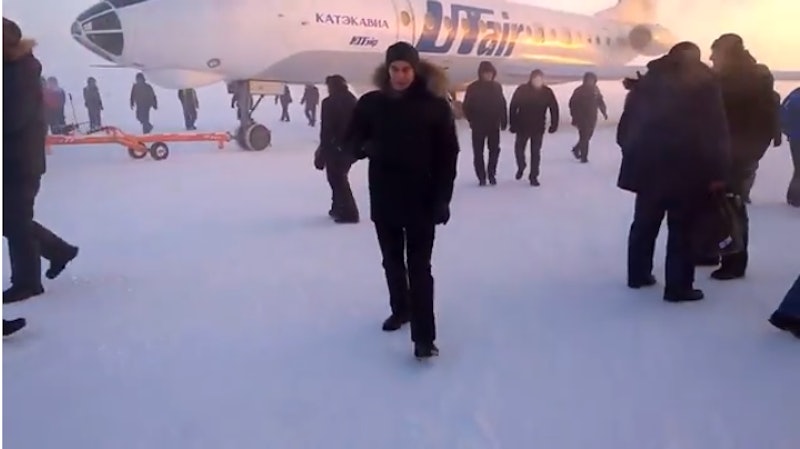 These Passengers In Siberia Pushing Their Frozen Plane Onto The