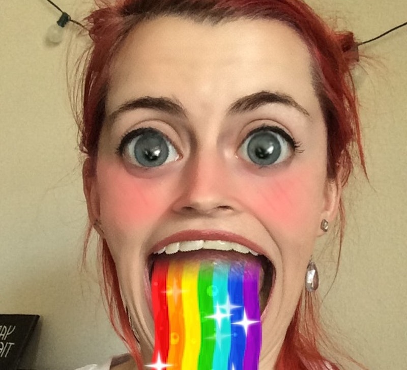 Woman using a Snpachat lens that makes it look like one is puking rainbows 