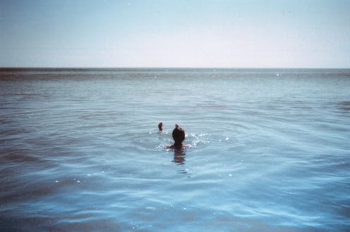 Recovering addicts swimming in the middle of the sea on a bright summer day