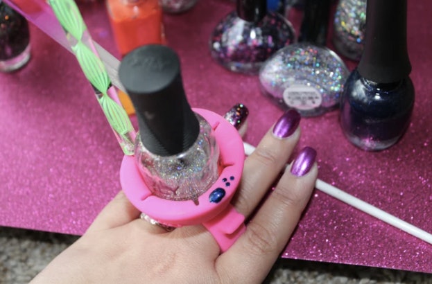 The design of this new wearable nail polish holder makes painting your nails  a lot easier