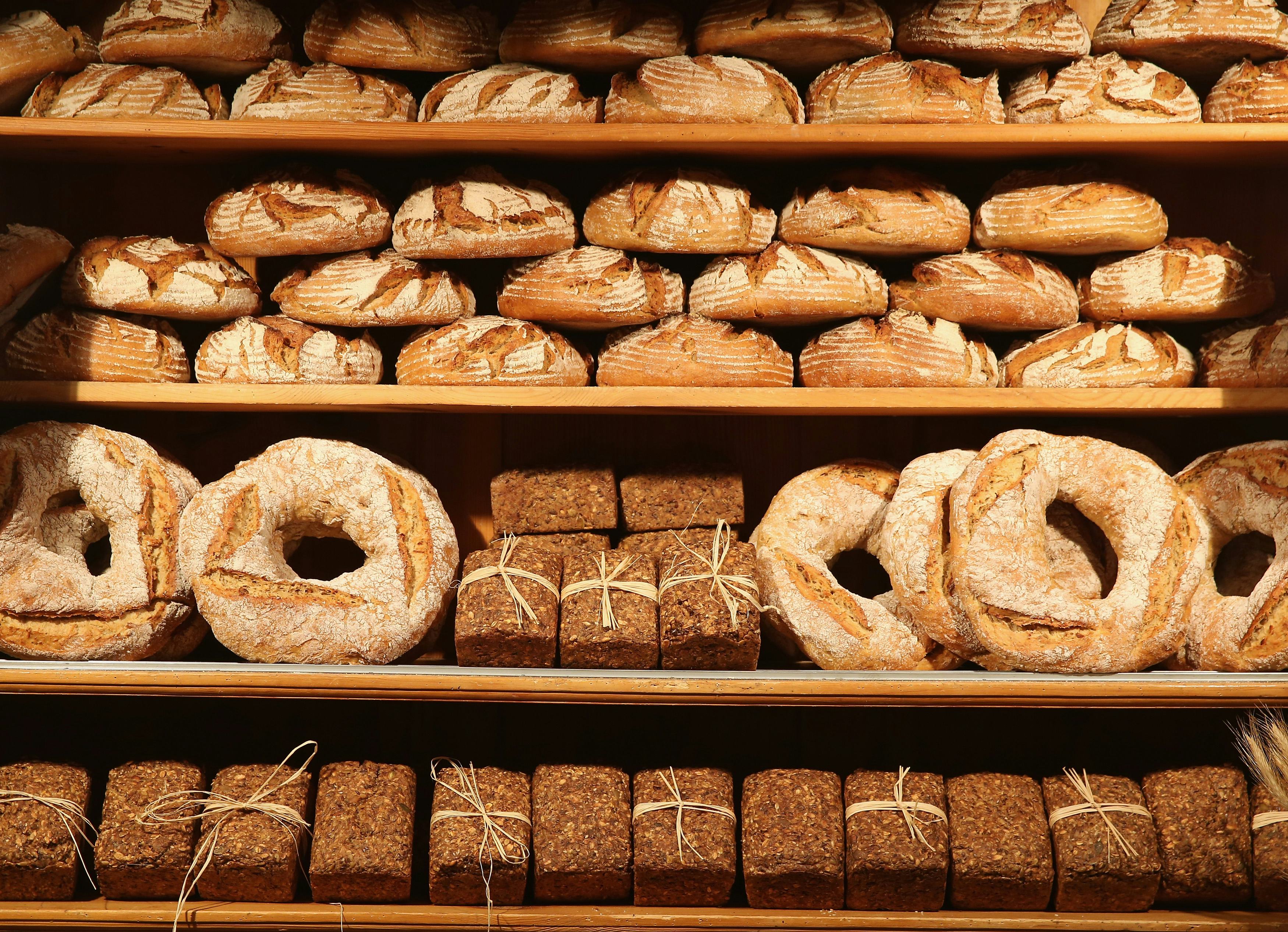 For rows of different types of bread displayed at a bakery