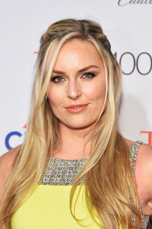 World Cup and Olympic skier Lindsey Vonn wearing a yellow dress on a red carpet