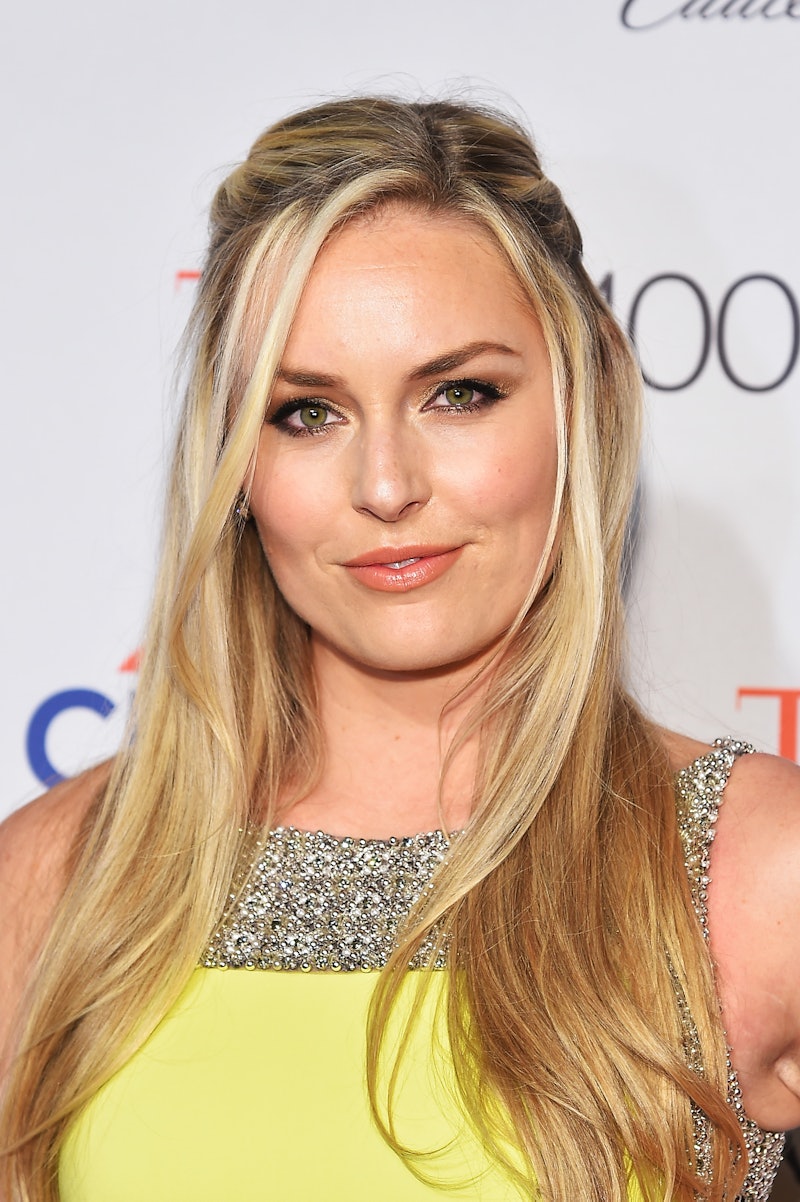 World Cup and Olympic skier Lindsey Vonn wearing a yellow dress on a red carpet